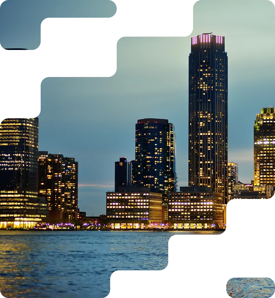 City skyline at night with illuminated buildings